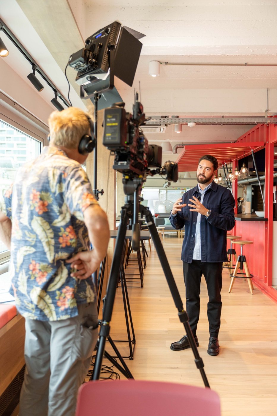 In front of the camera.