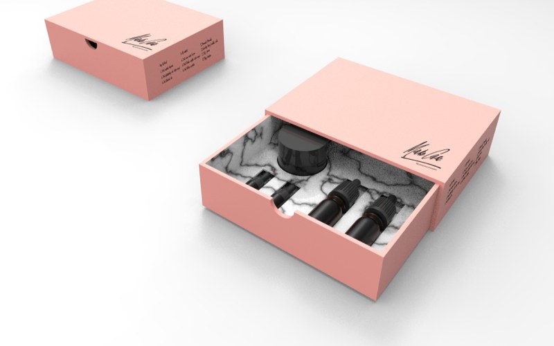 The slide-out box, in blush pink with a marble inlay.